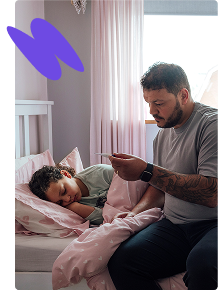 Father looking after poorly young son