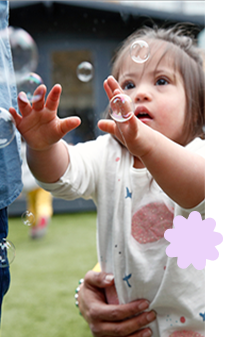 Father looking after toddler son blowing nose